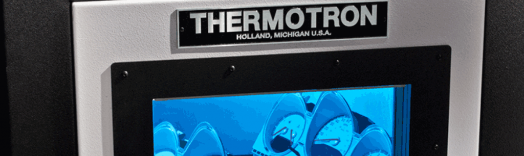 Thermotron Environmental Chamber Door with Automotive Parts Inside - Automotive Testing Expo
